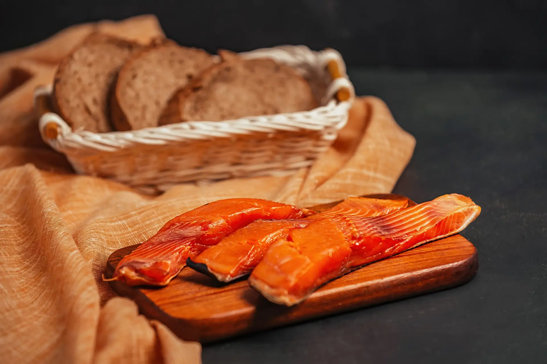 Hot‑smoked salmon fillet on a cedar plank over gas BBQ