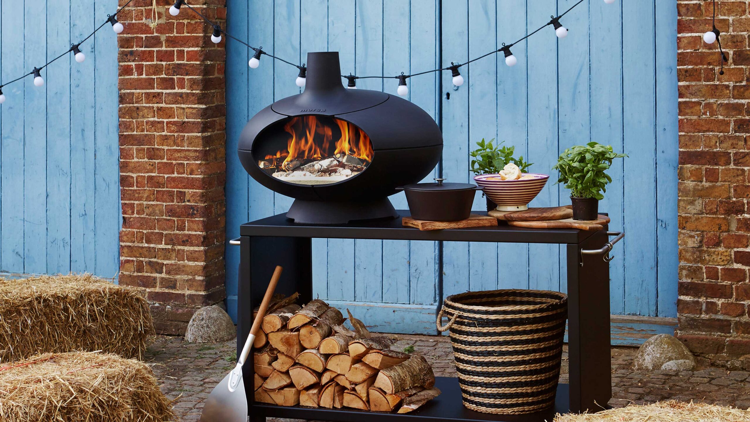 ## Introduction: Winter BBQ Is Easier With the Right Winter BBQ Gear  Cooking Christmas dinner on the BBQ in the UK means battling freezing temperatures, gusty winds, sideways rain, and pitch-black gardens by 4pm. That is why winter barbecue success is **50% skills — and 50% having the right winter BBQ gear**.  In this complete **winter BBQ gear** guide for UK gardens, we cover the essential equipment that keeps your smoker temperatures rock-steady, protects your hands from freezing metal, and lets you monitor your Christmas turkey from the warmth of your sofa[cite: 8].  > **Affiliate Disclosure:** *As an Amazon Associate, Kitchen Sizzlers earns from qualifying purchases at no extra cost to you. You can also browse our full hand-picked gear collections on the [Official Kitchen Sizzlers Amazon UK Storefront](https://www.amazon.co.uk/shop/amaffilia0e77).*  ## ⭐ 1. Heat-Resistant BBQ Gloves (Winter BBQ Gear Essential #1)  Cold December weather turns metal smoker latches, chimney starters, and cast-iron grates into ice blocks before lighting—and makes burns far more likely once your fire is roaring[cite: 8].  A proper pair of winter pitmaster gloves must be[cite: 8]:
* **Thick (500°C–800°C heatproof rating)** with a soft cotton inner lining for cold insulation[cite: 8]
* **Non-slip silicone grip** so heavy turkey trays never slide out of your hands[cite: 8]
* **Long-cuffed** to protect your wrists and coat sleeves when reaching inside hot cabinets[cite: 8]
* **Flexible enough** to handle tongs, vents, and charcoal baskets safely[cite: 8]  * 🛒 **Shop on Amazon UK:** [Check Prices on Heat-Resistant 800°C EN407 BBQ Gloves](https://www.amazon.co.uk/s?k=heat+resistant+bbq+gloves+800c&tag=amaffilia0e77-21)  ## ⭐ 2. Instant-Read & Wireless Meat Thermometers (Non-Negotiable)  Freezing ambient air messes with cooking times, and every time you lift the lid in December, your smoker loses 15–20 minutes of heat recovery[cite: 8]. Relying on a built-in dome thermometer is a recipe for an undercooked bird or dry brisket.  The only way to guarantee a juicy, food-safe Christmas turkey is pairing a dual-probe wireless thermometer with a fast instant-read pocket probe[cite: 8]:
* **Fast readings (1–2 seconds)** so the lid stays closed[cite: 8]
* **Backlit digital display** for dark winter afternoons[cite: 8]
* **Bluetooth or WiFi app alerts** so you can track internal meat temperatures from indoors
* **Accurate to ±0.5°C** for total food safety[cite: 8]  * 🛒 **Shop on Amazon UK:** [Browse Wireless WiFi & Instant-Read BBQ Thermometers](https://www.amazon.co.uk/s?k=wireless+meat+thermometer+bbq+uk&tag=amaffilia0e77-21) or view our tested picks in the [Kitchen Sizzlers Amazon Storefront](https://www.amazon.co.uk/shop/amaffilia0e77).
* 📖 **Internal Guide:** Check our [Safe Internal Food Temps (°C) UK Guide](/beginners-guides/probe-safe-temps/) so you hit the exact target temperature for poultry, pork, and beef.  ## ⭐ 3. Grill Lights & LED Head Torches (Winter Darkness Fix)  In the UK, the sun sets before 4pm in December—often while your Christmas meats are still resting, glazing, or carving[cite: 8]. Trying to hold a slippery phone torch over a hot grill while basting a turkey is an accident waiting to happen[cite: 8].  The best winter lighting options include[cite: 8]:
* **Magnetic BBQ handle lights** that clip straight onto your smoker lid and angle down onto the grates[cite: 8]
* **Hands-free rechargeable LED head torches** so light follows wherever you look[cite: 8]
* **Weatherproof LED floodlights** for illuminating your patio prep table[cite: 8]  * 🛒 **Shop on Amazon UK:** [Check Prices on Magnetic BBQ Grill Lights & Rechargeable Head Torches](https://www.amazon.co.uk/s?k=magnetic+bbq+grill+light+weatherproof&tag=amaffilia0e77-21)  ## ⭐ 4. Heavy-Duty Chimney Starter (Fuel-Saving Game-Changer)  Lighting damp charcoal in freezing wind can be miserable without the right **winter BBQ gear**[cite: 8]. A heavy-duty aluminised steel chimney starter funnels draught upwards so briquettes and lumpwood catch quickly regardless of the weather[cite: 8]:
* **Lights charcoal in 15–20 minutes** without chemical lighter fluid tainting your food[cite: 8]
* **Works reliably in cold, damp air** when paired with natural wood-wool firelighters[cite: 8]
* **Produces even, predictable heat** for two-zone kettle setups or bullet smokers[cite: 8]  * 🛒 **Shop on Amazon UK:** [See Heavy-Duty Charcoal Chimney Starters & Eco Firelighters](https://www.amazon.co.uk/s?k=weber+rapidfire+chimney+starter&tag=amaffilia0e77-21)
* 📖 **Internal Guide:** Pair your charcoal with the best festive fruitwoods using our [Smoking Wood for Beginners (UK Edition)](/beginners-guides/smoking-wood-for-beginners-uk/) guide.  ## ⭐ 5. Ventilated BBQ Shelter, Gazebo, or Metal Pergola (Safe Rain Protection)  Rain doesn't stop a British pitmaster, provided your setup is dry and properly ventilated[cite: 8]. Always use a **non-flammable, open-sided shelter**—never cook inside a garage, shed, or enclosed marquee due to deadly carbon monoxide buildup[cite: 8].  Safe UK garden shelter options include[cite: 8]:
* **Steel-framed vented BBQ gazebos** with side shelves for utensils and trays[cite: 8]
* **Open-sided metal pergolas** positioned away from overhanging trees[cite: 8]
* **Heavy-duty cantilevered patio parasols** for light drizzle protection[cite: 8]  * 🛒 **Shop on Amazon UK:** [Browse Vented Steel BBQ Gazebos & Grill Shelters](https://www.amazon.co.uk/s?k=bbq+gazebo+shelter+metal+vented&tag=amaffilia0e77-21)  ## ⭐ 6. Heavy-Duty Windbreak (The Secret to Stable Smoker Temperatures)  Nothing ruins a low-and-slow Christmas cook faster than icy wind stripping convected heat away from your smoker walls[cite: 8]. In fact, wind affects cooking temperatures far more than freezing air alone[cite: 8].  Setting up a sturdy windbreak around your cooking zone will[cite: 8]:
* **Slash charcoal, pellet, or electricity usage** by up to 30%[cite: 8]
* **Stop gas burners from blowing out** on low heat settings[cite: 8]
* **Prevent erratic temperature spikes and drops** during long stalls[cite: 8]
* **Keep clean thin blue smoke moving steadily** across your meat[cite: 8]  * 🛒 **Shop on Amazon UK:** [Check Prices on Heavy-Duty Folding Outdoor Windbreaks](https://www.amazon.co.uk/s?k=heavy+duty+windbreak+camping+steel+poles&tag=amaffilia0e77-21)
* 📖 **Internal Guide:** Planning a long winter smoke? Run your meat weight through our [BBQ Smoker Time Calculator](/bbq-smoker-time-calculator/) to build in a winter weather buffer.  ## ⭐ 7. Extra-Wide Heavy-Duty Foil, Butcher Paper & Foil Trays  During winter cooks, heavy-duty foil and deep aluminium drip trays are absolute lifesavers[cite: 8]. Standard thin supermarket foil tears easily around bone-in joints and lets precious heat escape.  Keep a stack of deep catering foil trays and extra-wide foil on hand for[cite: 8]:
* **Texas Crutch wrapping** on brisket, pork shoulder, and beef short ribs[cite: 8]
* **Catching rich turkey drippings** inside the smoker for Christmas gravy[cite: 8]
* **Double-wrapping resting joints** before placing them into an insulated cooler[cite: 8]
* **Roasting festive sides** like pigs in blankets, chestnut stuffing balls, andglazed carrots with zero washing up[cite: 8]  * 🛒 **Shop on Amazon UK:** [Stock Up on Catering Heavy-Duty Foil Rolls & Deep BBQ Drip Trays](https://www.amazon.co.uk/s?k=heavy+duty+catering+foil+and+foil+trays+bbq&tag=amaffilia0e77-21)  ## ⭐ 8. Pre-Seasoned Cast Iron Skillets & Dutch Ovens  Cold weather punishes thin stainless steel pans, whereas thick cast iron absorbs heat deeply, blocks wind chill on the grates, and keeps Christmas side dishes piping hot all the way to the dining table[cite: 8].  Cast iron cookware is unbeatable on a winter barbecue for[cite: 8]:
* **Goose-fat roast potatoes** crisped over hot embers[cite: 8]
* **Smoked sage and onion stuffing** and charred Brussels sprouts with pancetta[cite: 8]
* **Simmering mulled wine, cranberry glaze, and rich pan gravies** right beside your main meat[cite: 8]  * 🛒 **Shop on Amazon UK:** [Browse Pre-Seasoned Cast Iron Skillets & BBQ Dutch Ovens](https://www.amazon.co.uk/s?k=pre+seasoned+cast+iron+skillet+dutch+oven+bbq&tag=amaffilia0e77-21)  ## ⭐ 9. Long-Handled BBQ Tools & Wire-Free Grill Brushes  Certain barbecue tools work far better in freezing weather than standard summer utensils[cite: 8]. Look for **winter BBQ gear** that keeps your hands away from steam and grease while speeding up meat prep[cite: 8]:
* **Long-handled stainless steel tongs and spatulas** so cold metal handles never touch your wrists[cite: 8]
* **Heavy-duty meat shredder claws (Bear Claws)** for shredding piping-hot pulled pork or lifting a whole Christmas turkey safely[cite: 8]
* **Bristle-free steam or coiled grill brushes** — freezing temperatures make cheap wire bristles brittle, increasing the risk of loose metal wires snapping onto your grates[cite: 8]  * 🛒 **Shop on Amazon UK:** [Check Prices on Bristle-Free Grill Brushes & Meat Claws](https://www.amazon.co.uk/s?k=bristle+free+grill+brush+and+meat+claws+bbq&tag=amaffilia0e77-21)  ## ⭐ 10. Insulated Smoker Blanket & Meat Resting Bag (For Long Smokes)  Pellet grills, bullet smokers, and electric cabinets—like the [Masterbuilt 710 WiFi Electric Smoker](/smoker-reviews/masterbuilt-710-wifi-digital-electric-smoker-review-connected-smoking-for-the-uk-bbq-scene/) or the [Masterbuilt Offset Electric Smoker](/smokers/masterbuilt-offset-electric-smoker-review/)—benefit massively from thermal insulation when temperatures drop near freezing[cite: 8].  Adding a fiberglass thermal smoker blanket (and an insulated meat resting bag for post-cook holding) helps you[cite: 8]:
* **Maintain rock-solid target temperatures** between 107°C and 121°C[cite: 8]
* **Save up to 40% on wood pellets or charcoal** in sub-zero wind chill[cite: 8]
* **Shorten recovery times** after basting or wrapping your meat[cite: 8]
* **Rest your turkey or brisket for 2–4 hours** in an insulated blanket bag while kitchen oven dishes finish cooking  * 🛒 **Shop on Amazon UK:** [See Thermal Insulated Smoker Blankets & BBQ Meat Resting Bags](https://www.amazon.co.uk/s?k=thermal+insulated+smoker+blanket+bbq+meat+resting+bag&tag=amaffilia0e77-21)  ## ⭐ 11. Household Items That Complement Your Winter BBQ Gear (And Save Money)  You don't need to buy everything brand new at once[cite: 8]. Alongside your core **winter BBQ gear**, several everyday household items double as brilliant cold-weather barbecue helpers[cite: 8]:
* **Old bath towels + a cool box (faux cambro):** Wrap foil-covered meat in thick towels inside a dry cooler to keep brisket or pork shoulder hot for up to 4 hours[cite: 8].
* **Deep oven roasting tins:** Ideal for catching meat juices or transferring hot joints indoors[cite: 8].
* **A wide golf umbrella:** Handy for shielding yourself while checking probes in a sudden shower (just keep it well clear of hot flues!)[cite: 8].  ## 🔥 Complete Winter BBQ Gear Checklist (Print or Screenshot)  Use this quick **winter BBQ gear** checklist before lighting your Christmas cook[cite: 8]:  **The Essentials:**
* Heatproof 800°C BBQ gloves[cite: 8]
* Wireless dual-probe & instant-read thermometers[cite: 8]
* Magnetic grill light or LED head torch[cite: 8]
* Deep catering foil trays & extra-wide heavy-duty foil[cite: 8]
* Extra 30–50% reserve of charcoal, pellets, or gas[cite: 8]
* Heavy-duty garden windbreak[cite: 8]
* Pre-seasoned cast iron skillet[cite: 8]
* Long-handled stainless steel tongs[cite: 8]
* Chimney starter & natural eco firelighters[cite: 8]  **Nice-to-Have Winter Upgrades:**
* Vented steel BBQ gazebo or shelter[cite: 8]
* Thermal insulated smoker blanket & resting bag[cite: 8]
* Insulated water-resistant pitmaster apron & warm boots[cite: 8]
Essential winter BBQ gear heat-resistant gloves for UK Christmas grilling